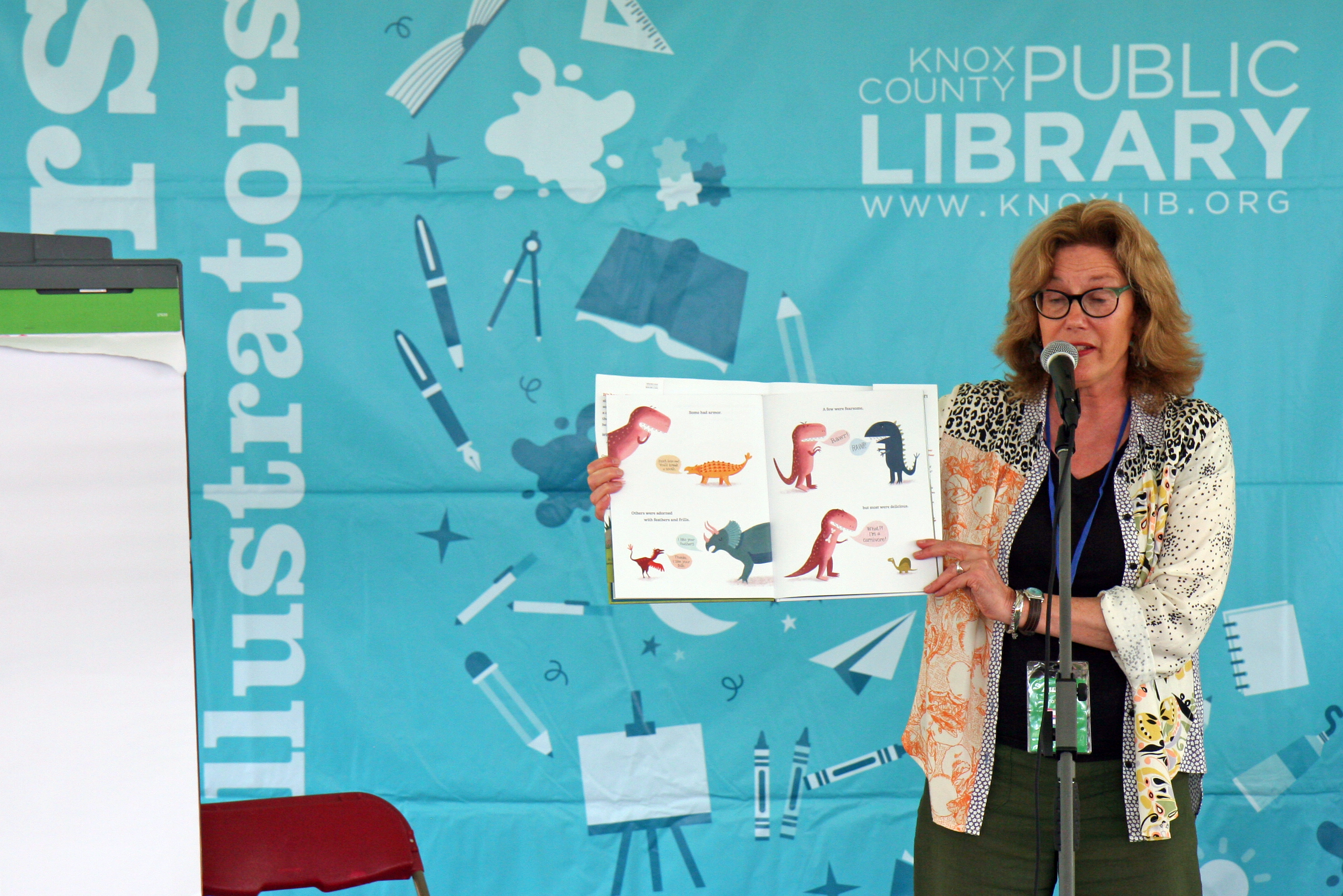 author Deb Pilutti reads from one of her books