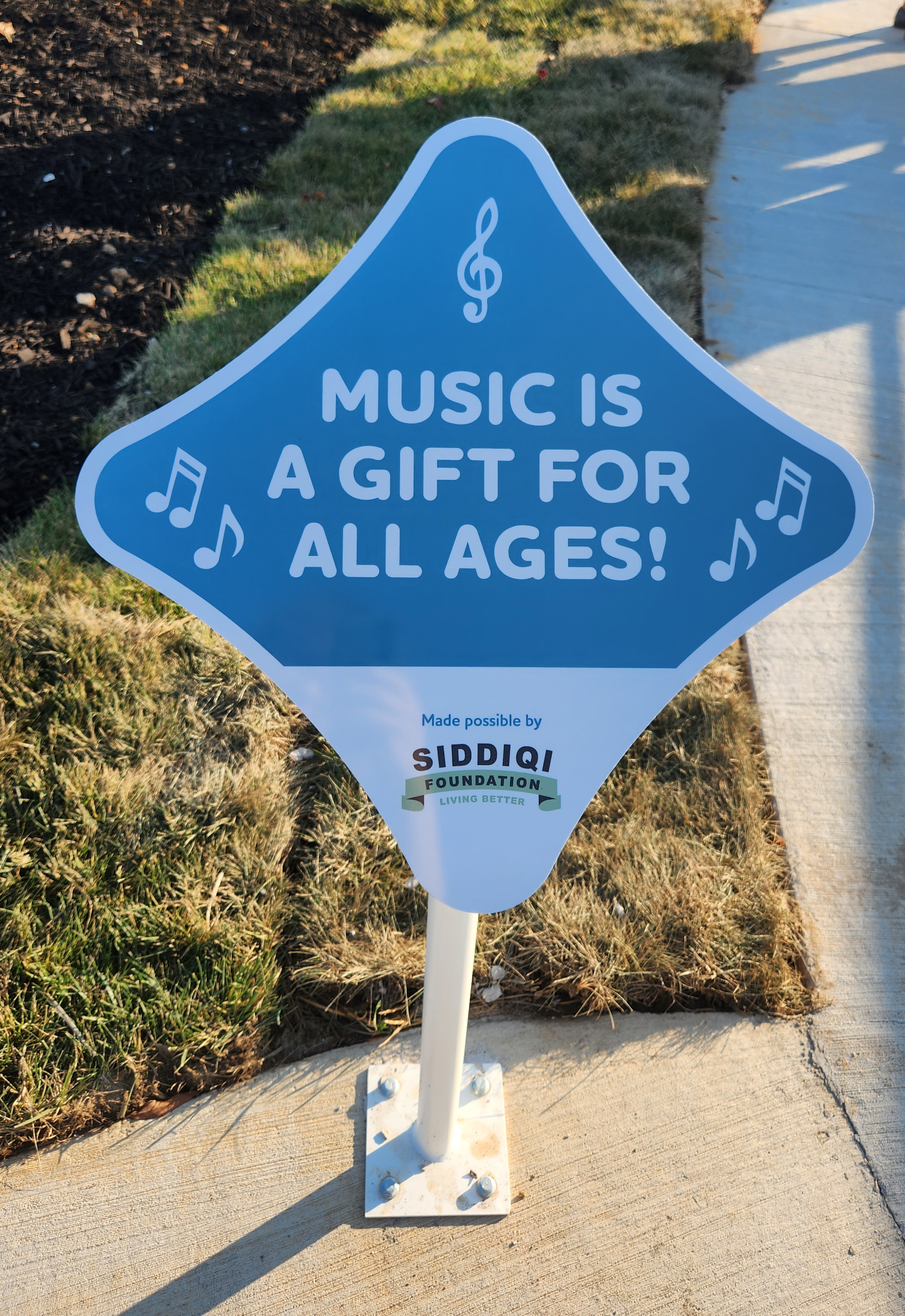 photo of a sign reading "Music is a gift for all ages!"