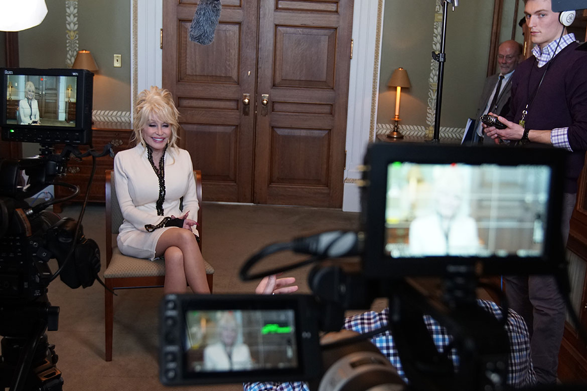 A closeup of Dolly Parton during her interview for The Library That Dolly Built