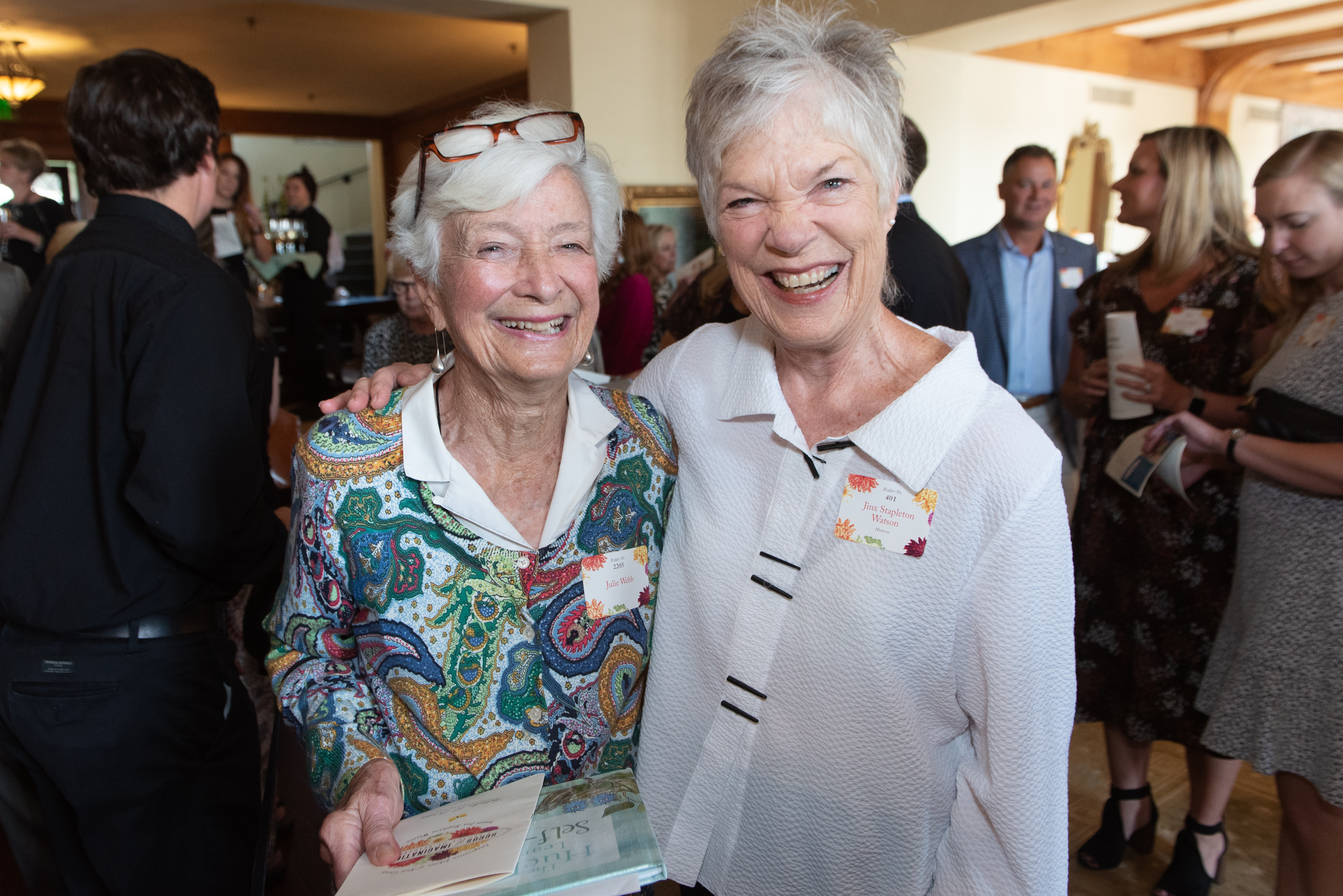 Jinx Watson pauses with Julie Webb for a photo before the luncheon