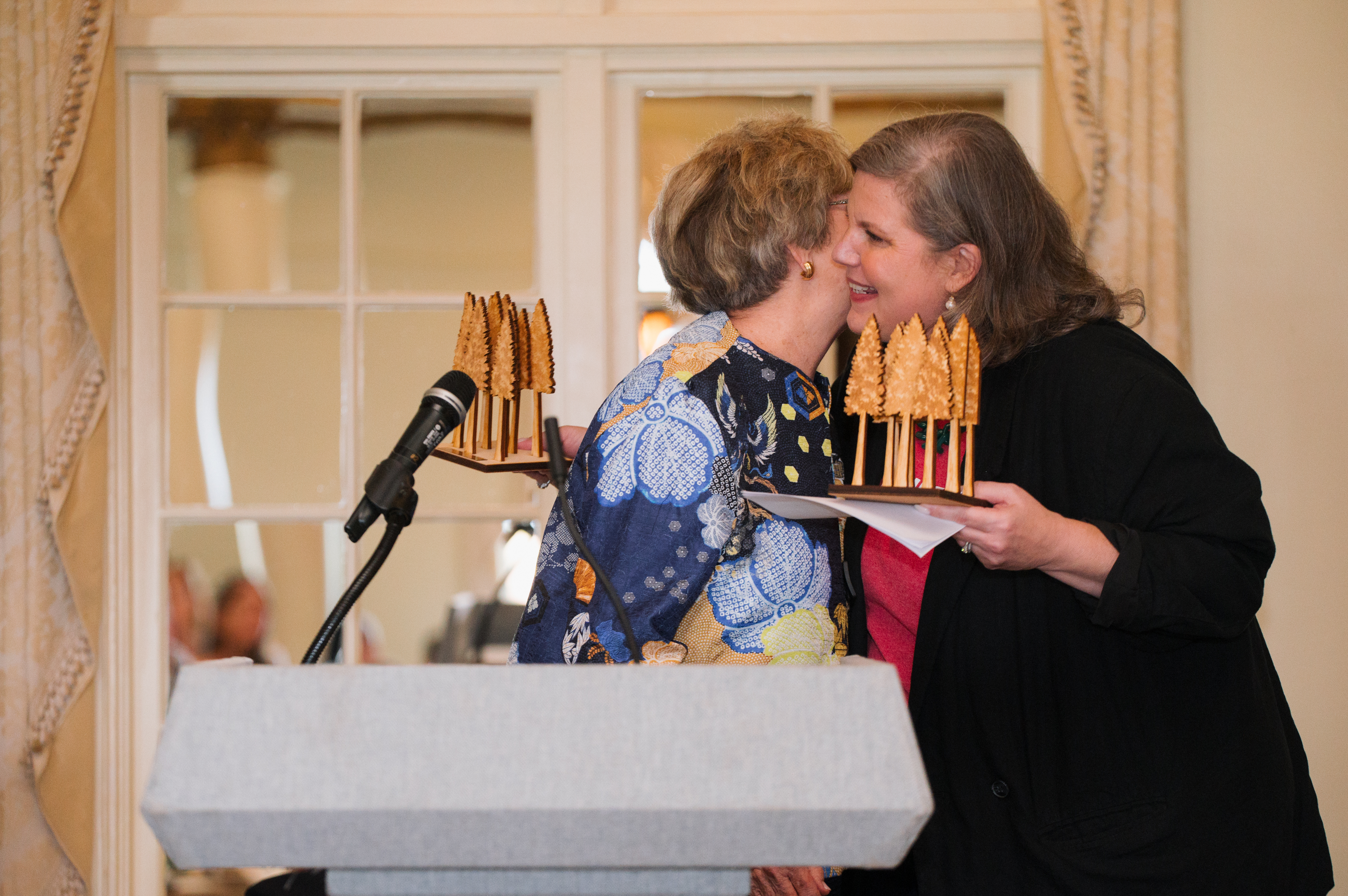 Ellie embracing Bonny as she accepts her Seeds of Imagination award