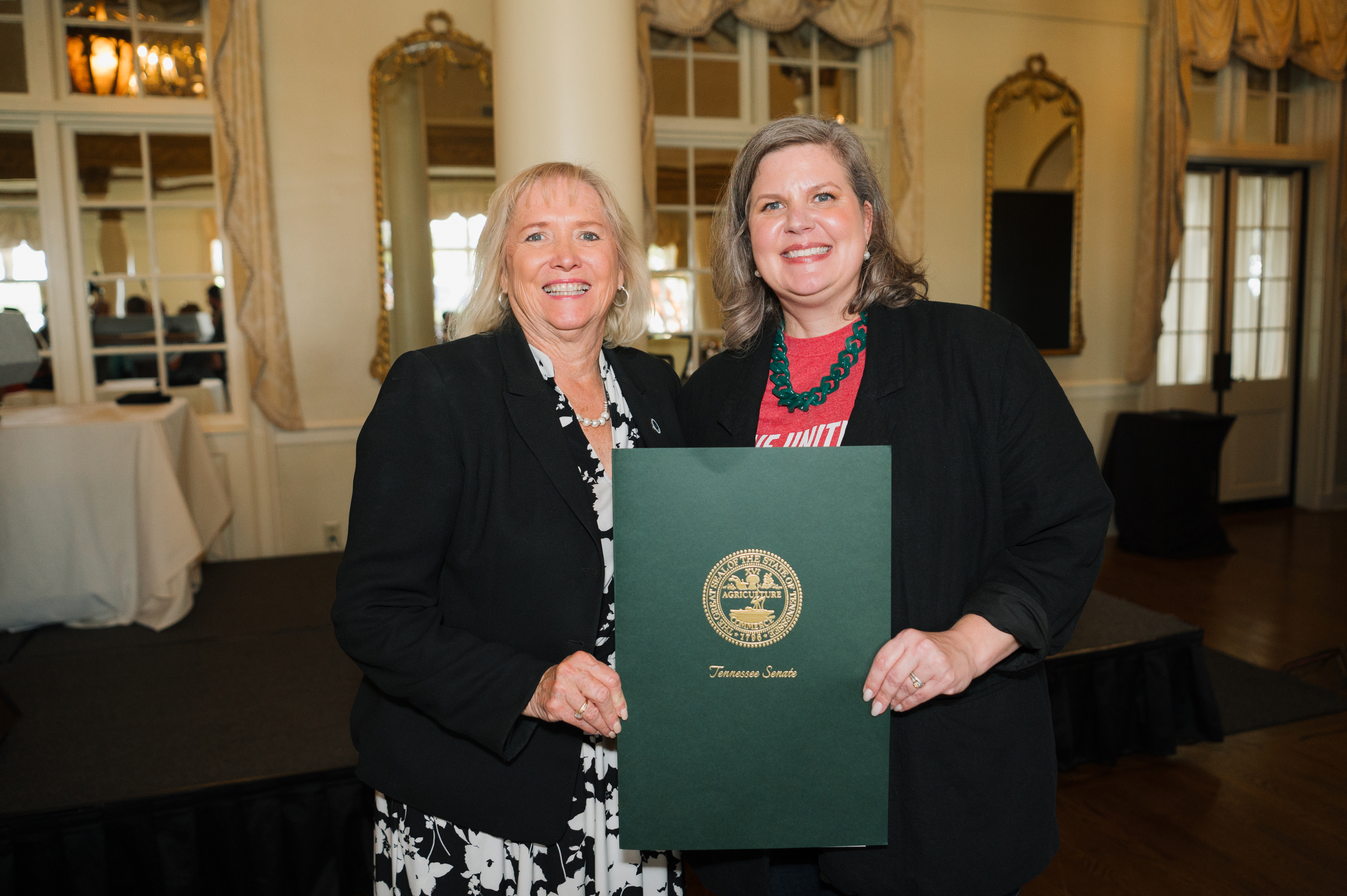 Senator Massey and Ellie Kittrell smiling with award