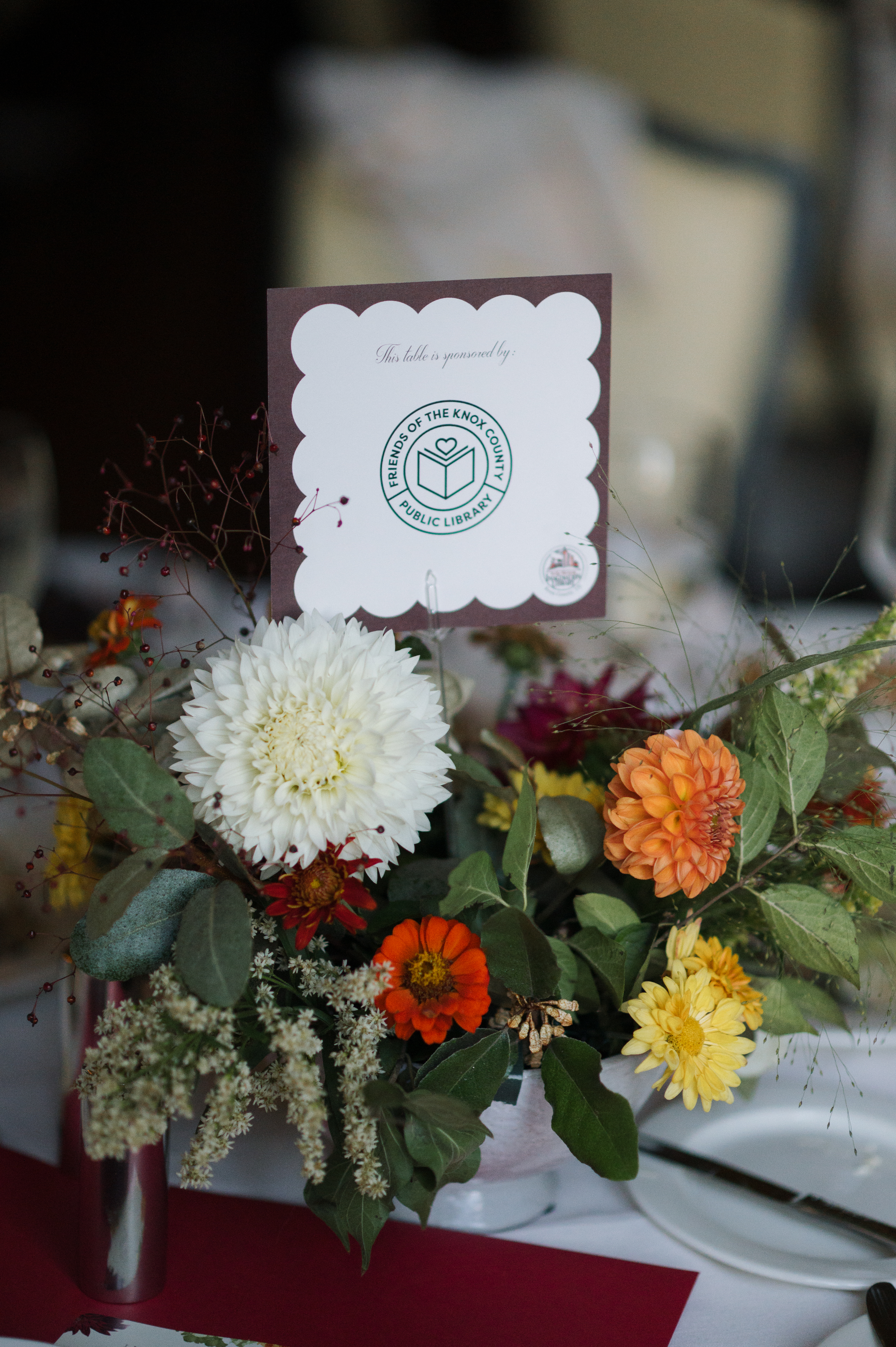 A bouquet of flowers with a table placecard