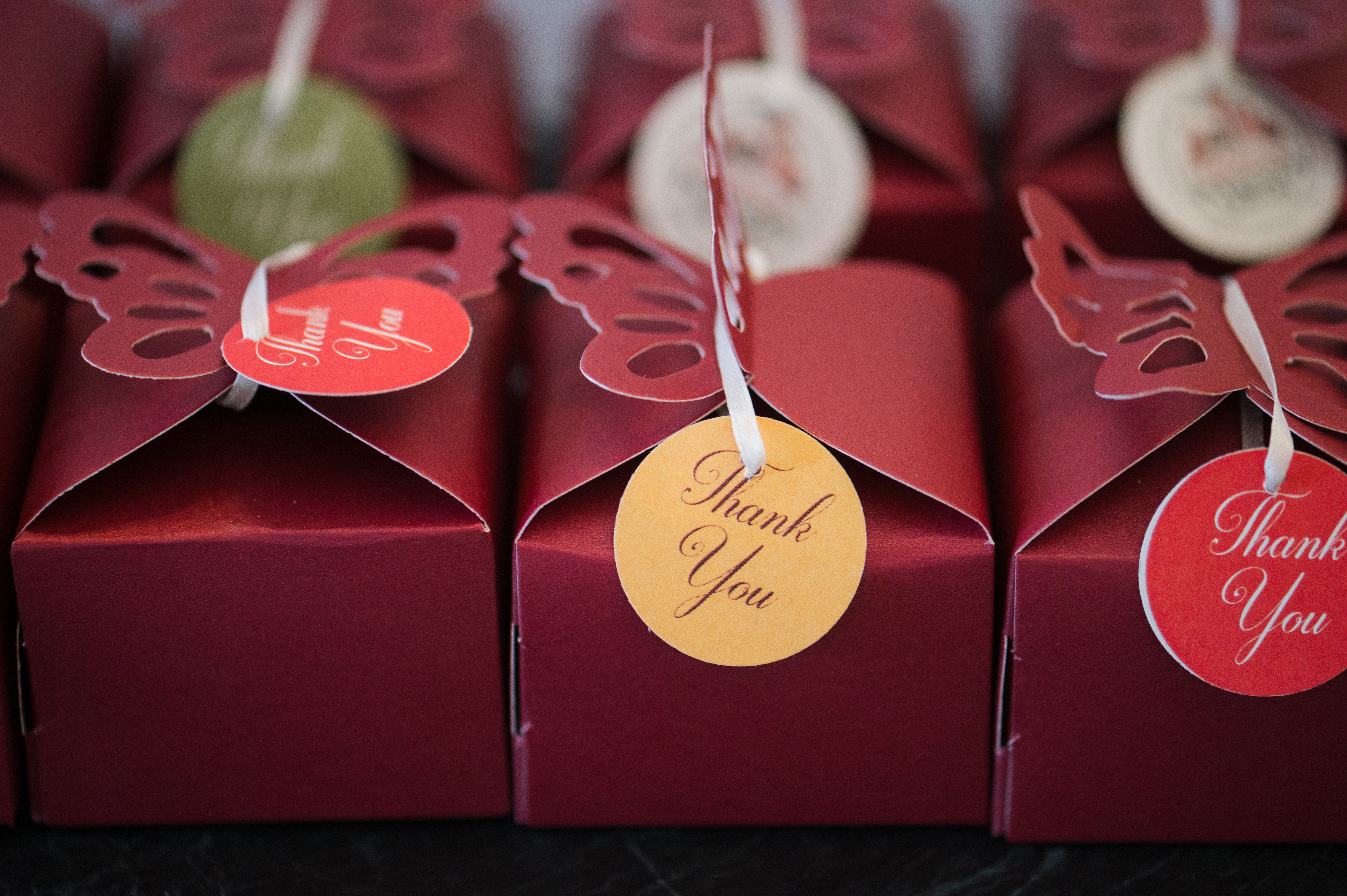 Red cardboard boxes with tiny thank-you tags