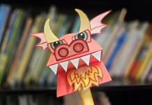 photo of a colorful paper dragon hand puppet