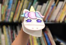 photo of a colorful paper unicorn hand puppet