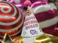 photo of birthday hat, "Happy Birthday, Dolly"