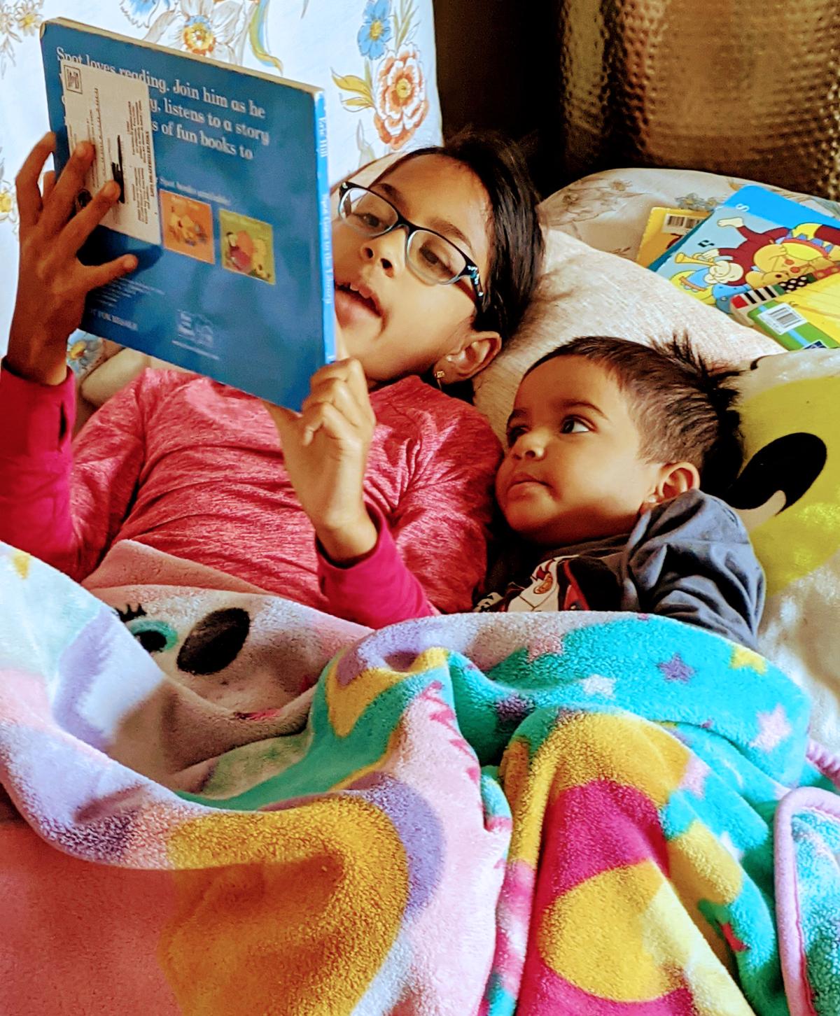 two children reading together