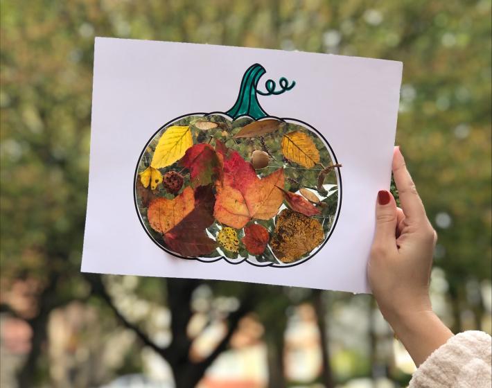 photo of pumpkin shaped craft filled with leaves