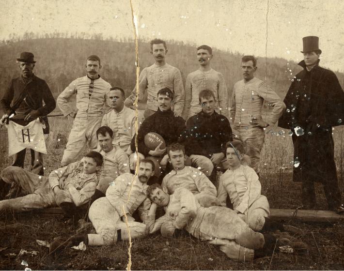 1894 portrait of football team, 15 men standing, kneeling, and reclining